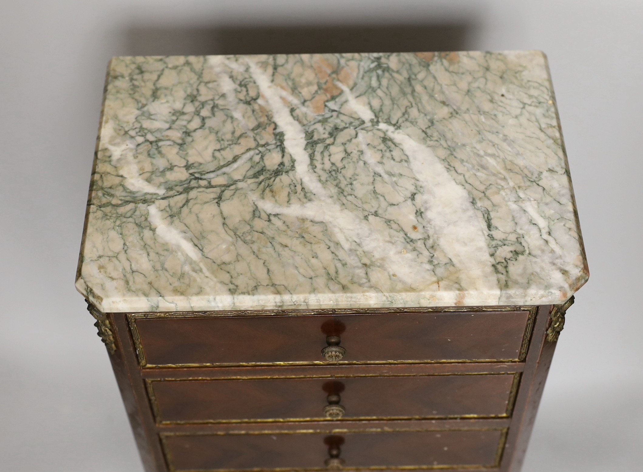 A 20th century French style miniature marble top six drawer chest, possibly an apprentice piece, 46.5cms high